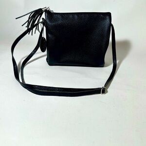 Sleek Black Crossbody Bag with Adjustable Strap and Tassel